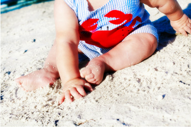 Baby playing in the sand