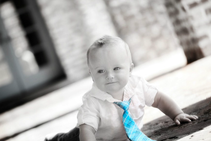 Black and white baby with blue tie